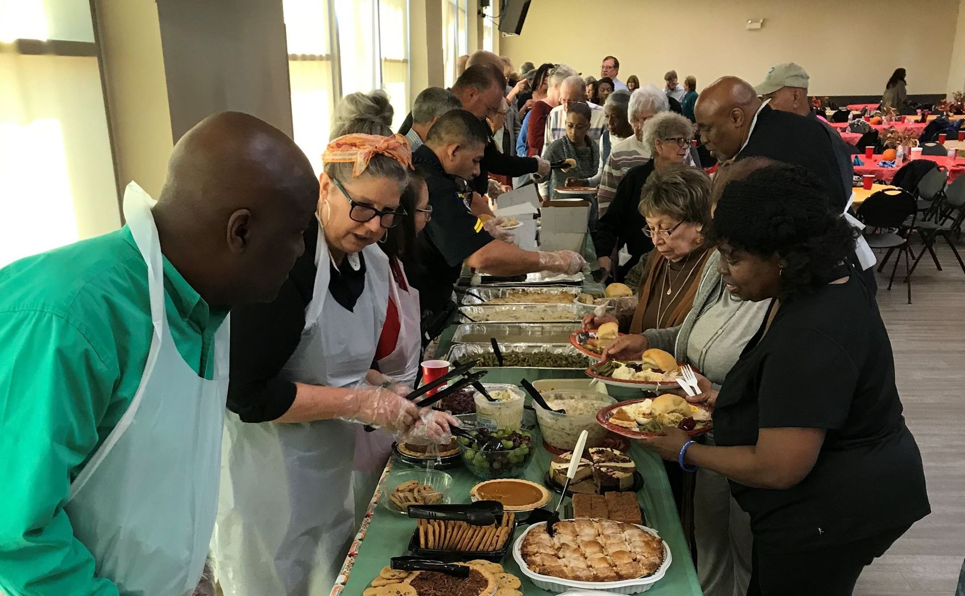 City Staff Serving Meals to Adults 55+